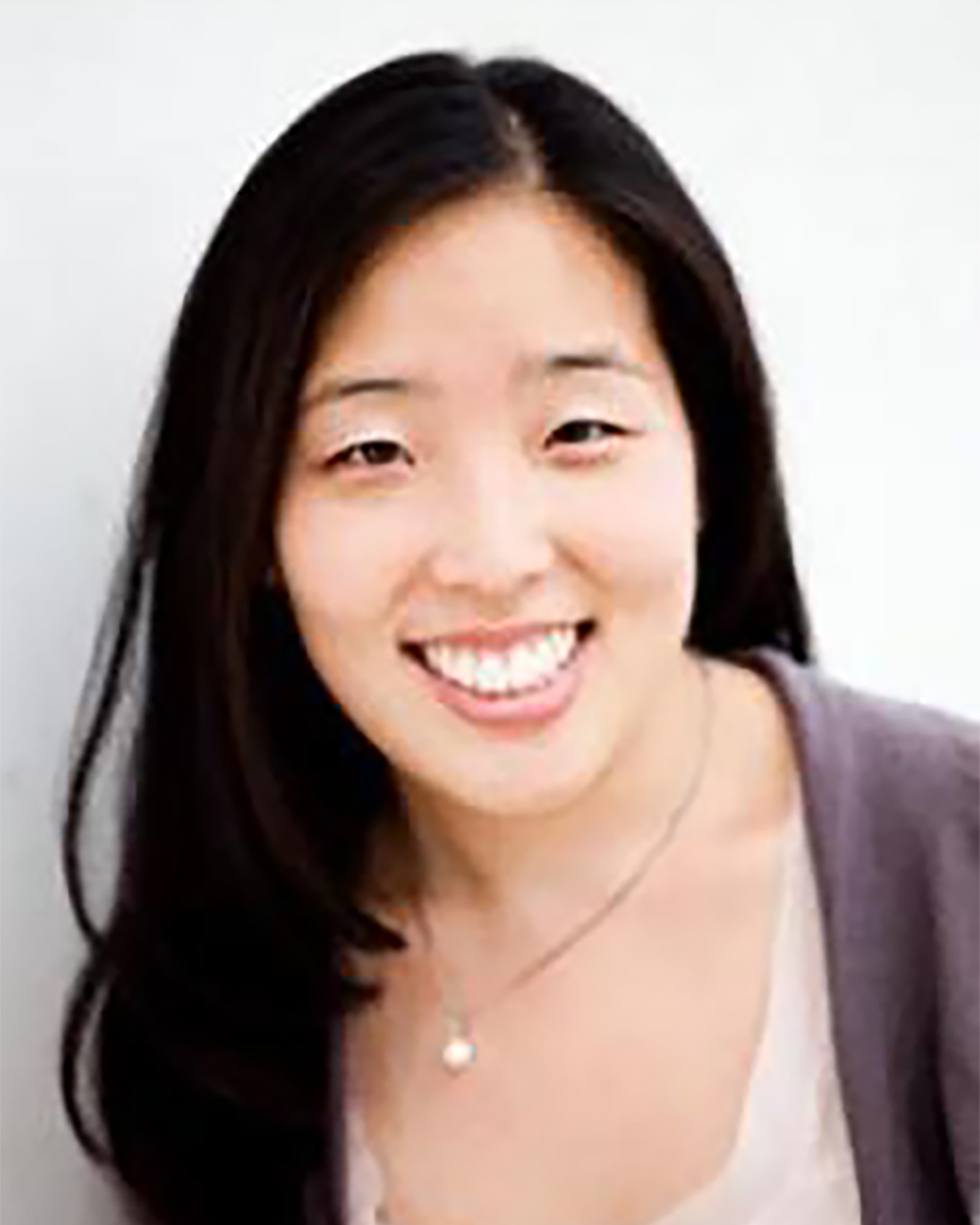 Cecilia Mo Cecilia Mo smiling in a pink top againsgt a white background