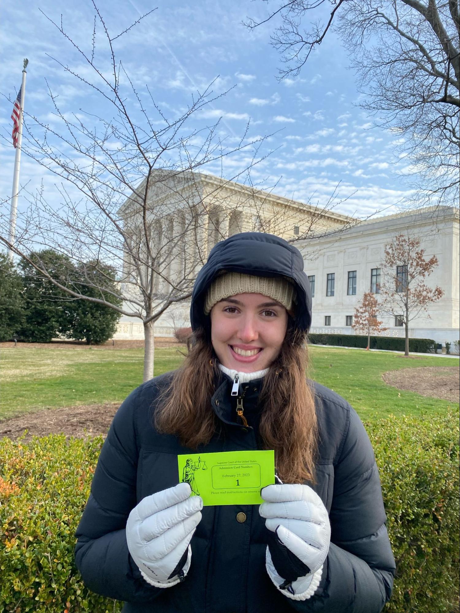 Spring 2023 UCDC Intern Cecilia Wolfcale standing outside bundled up in a puffer coat