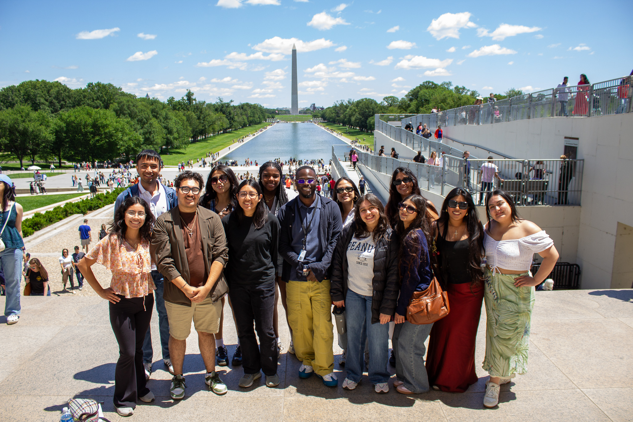 UC Berkeley students pose for a picture on the Lincoln Memorial steps with the Washington Monument in the background