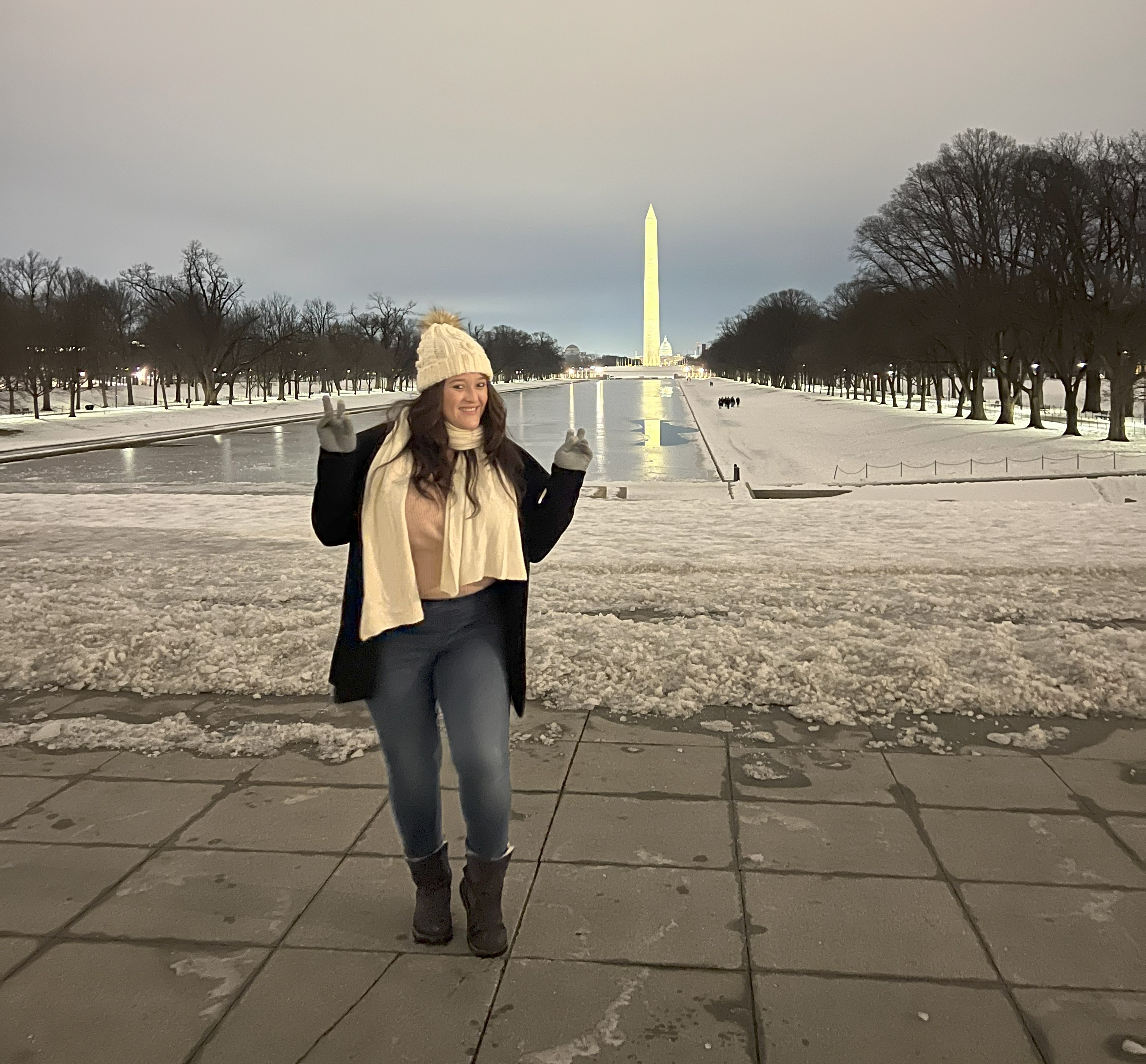 lady poses in front of monument