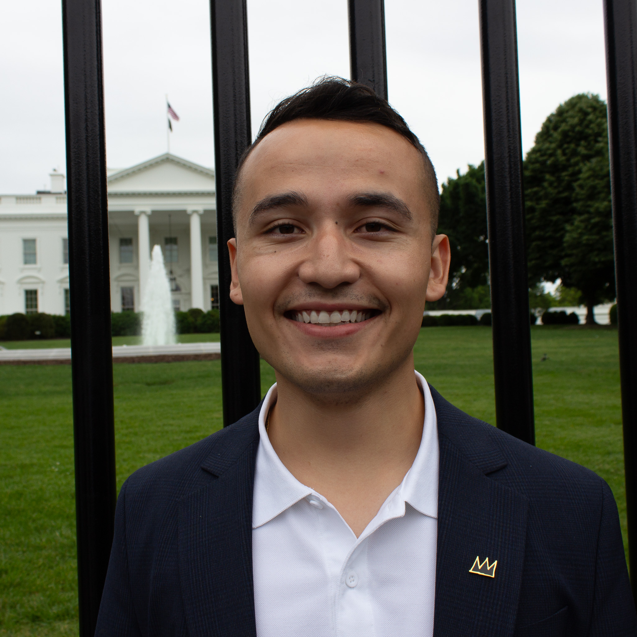 2022 Democracy Camp in DC Fellow Gelser Zavala Garcia stands smiling outside the White House