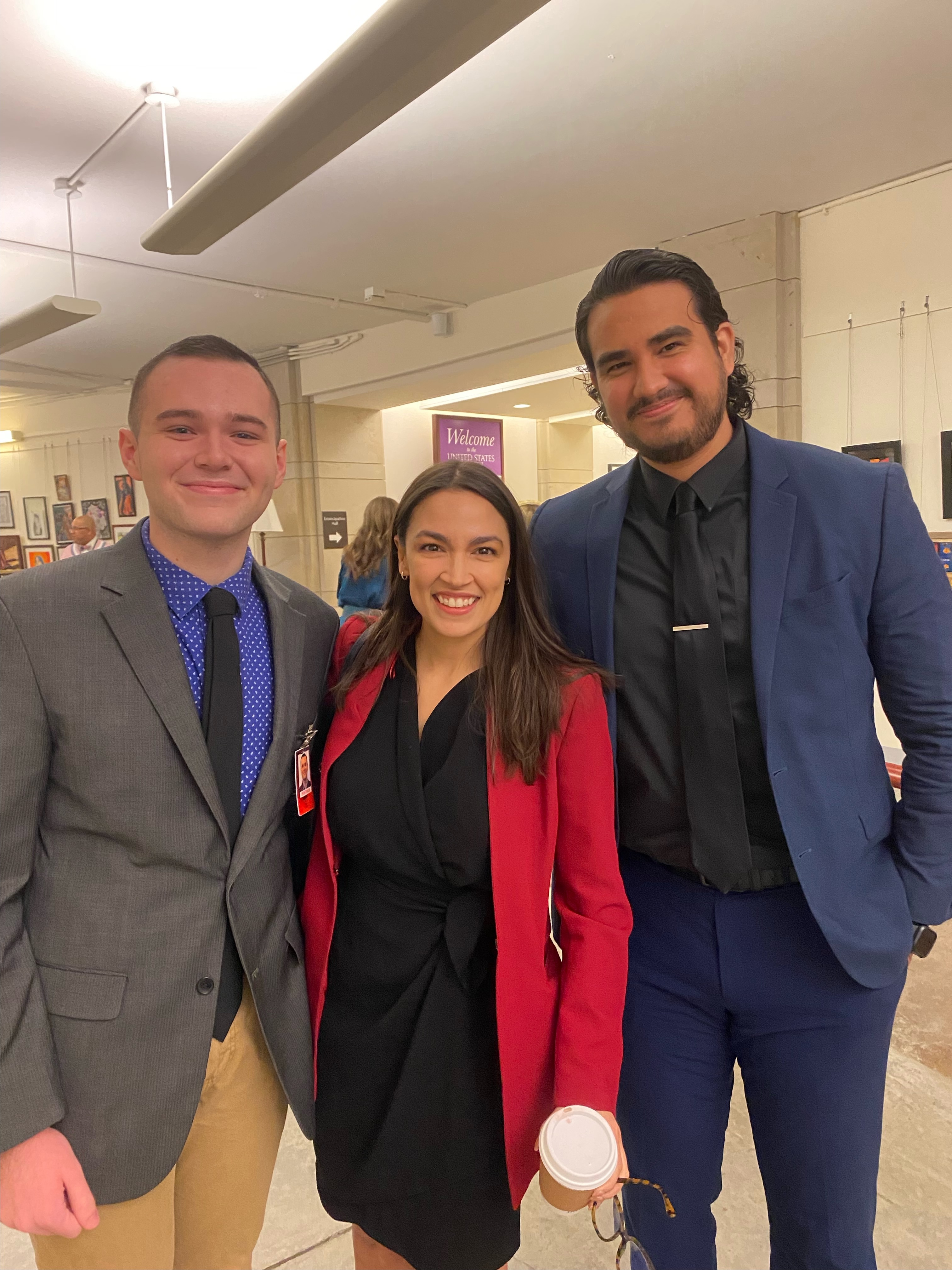 Spring 2023 UCDC Fellow Luis Leon Lopez standing with Rep. AOC