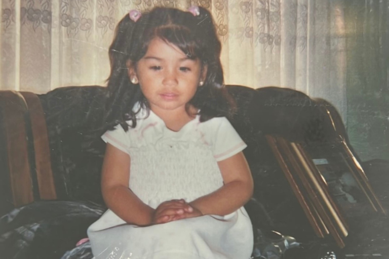 baby picture of latina woman looking down