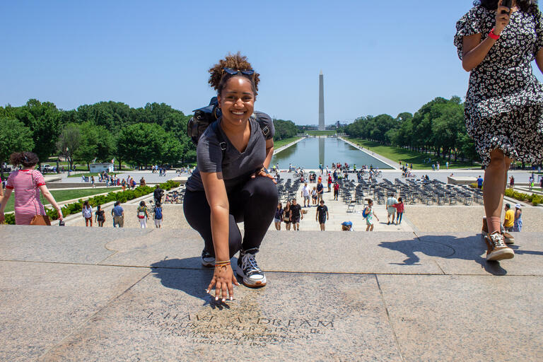 DC in DC Fellow Tatiana Butte crouches where MLK stood to give the "I Have A Dream" Address
