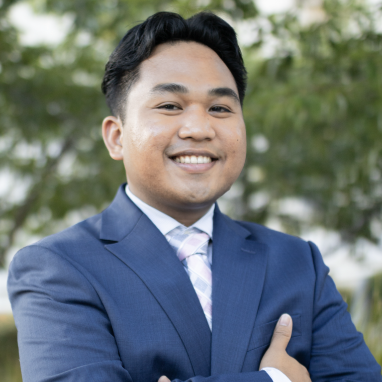 young asian man poses in professional photo