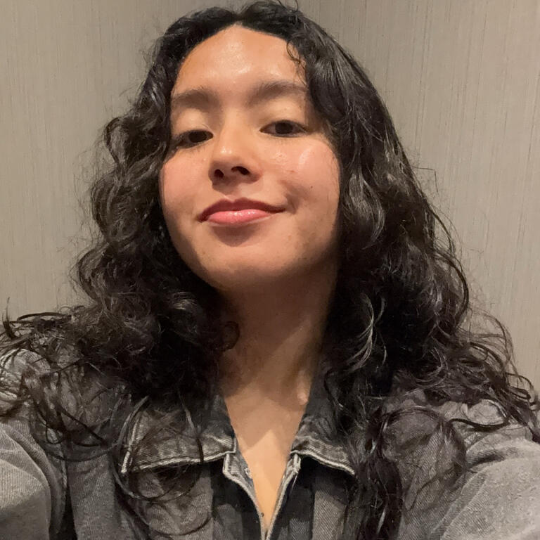young latina woman smiles in selfie