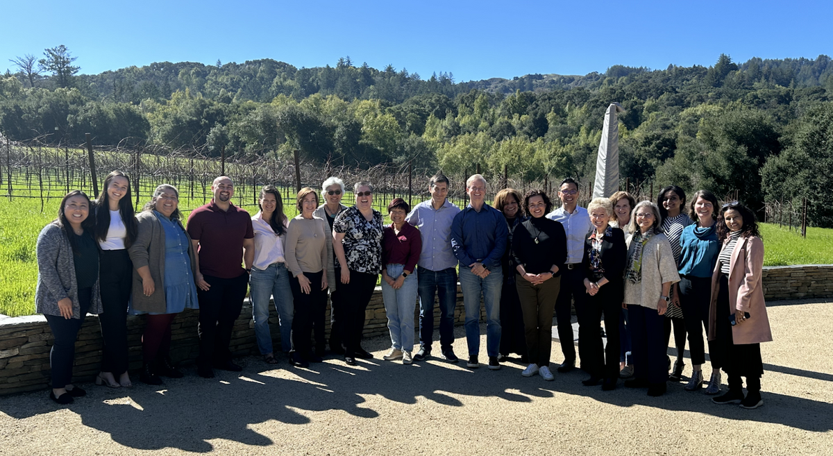 group photo of 2023 UC Berkeley Gardner Fellow Jon Dena at a Silicon Valley Social Venture Fund board meeting held at a Portola Valley winery