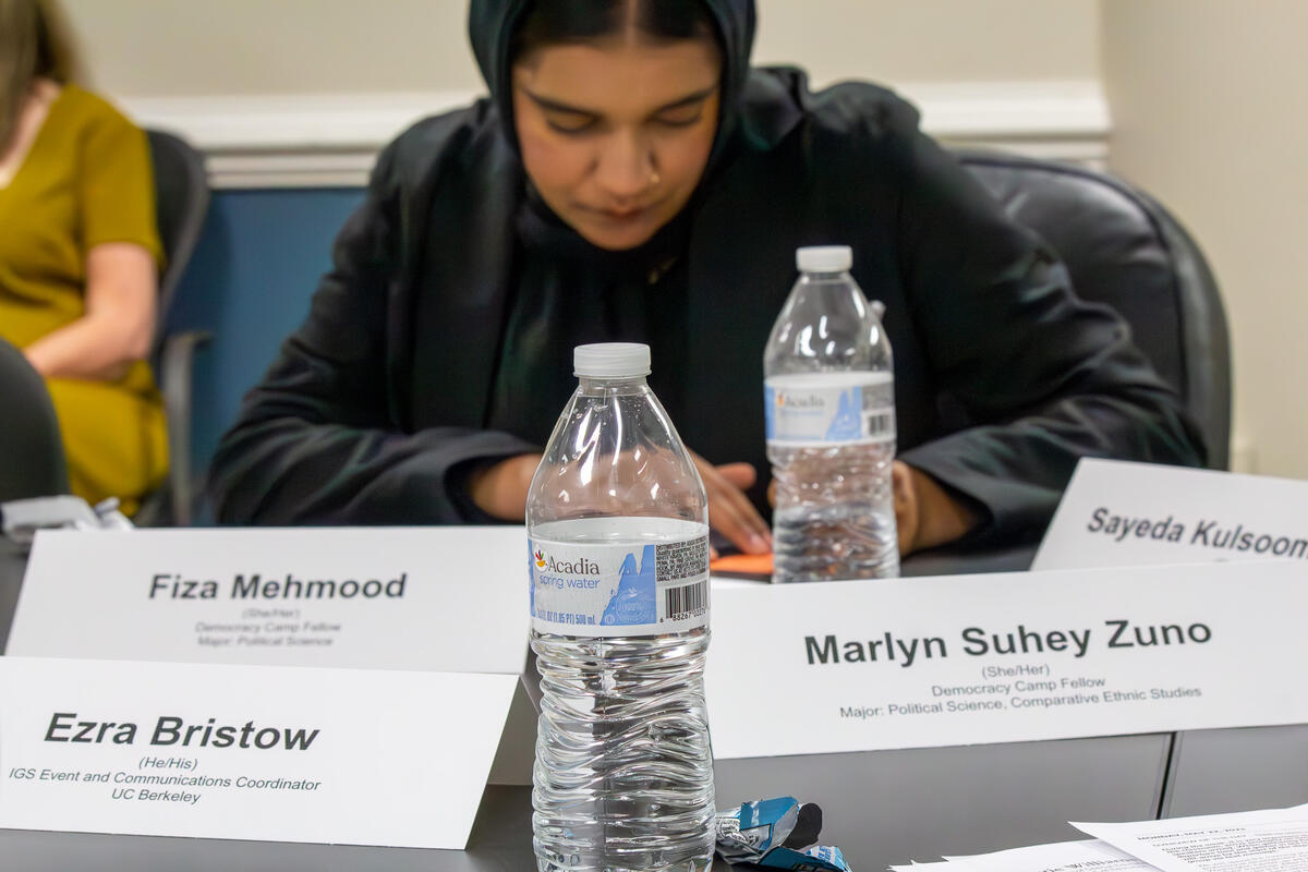 Fiza Mehmood takes notes during a panel session at the US Department of Homeland Security