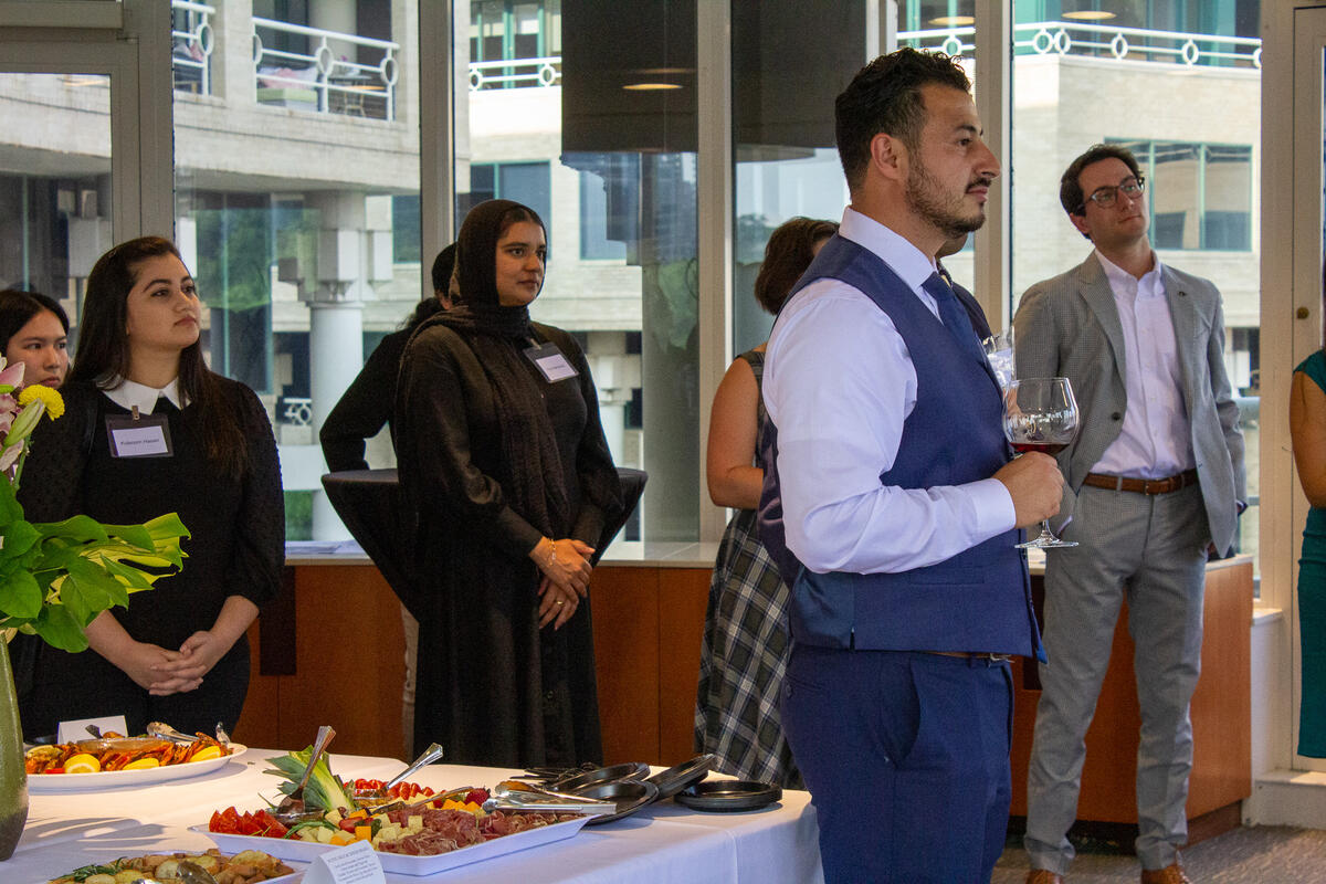 (From left) Ngan Pham, Kulsoom Hasan (Political Science, minor in Public Policy, ’23), Fiza Mehmood, David Carranza (American Studies, ’23), and Alex Vaughn (UC Berkeley alum and Senate Judiciary Aide) listen to remarks at the Cal Alumni Reception