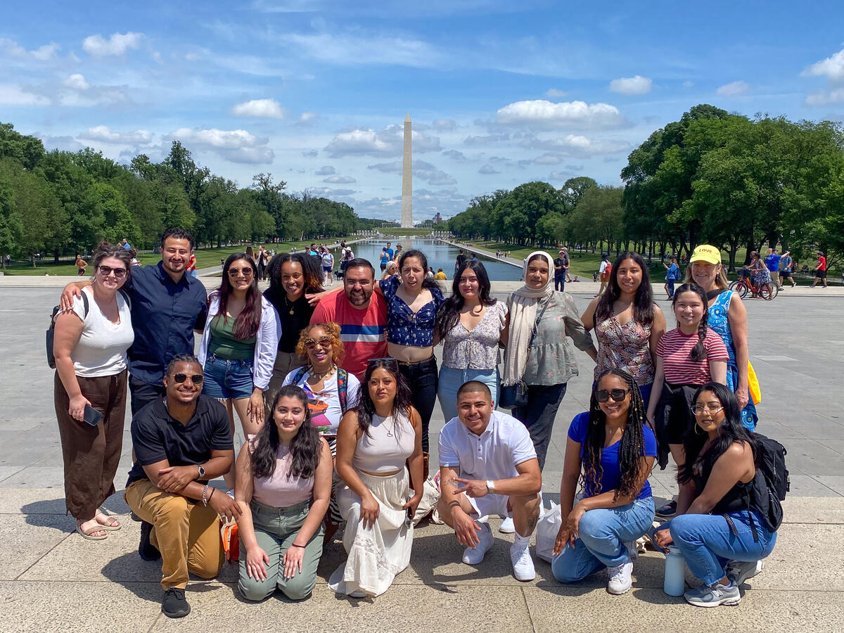 2023 Democracy Camp in DC cohort pose with the Washington Monument in the background