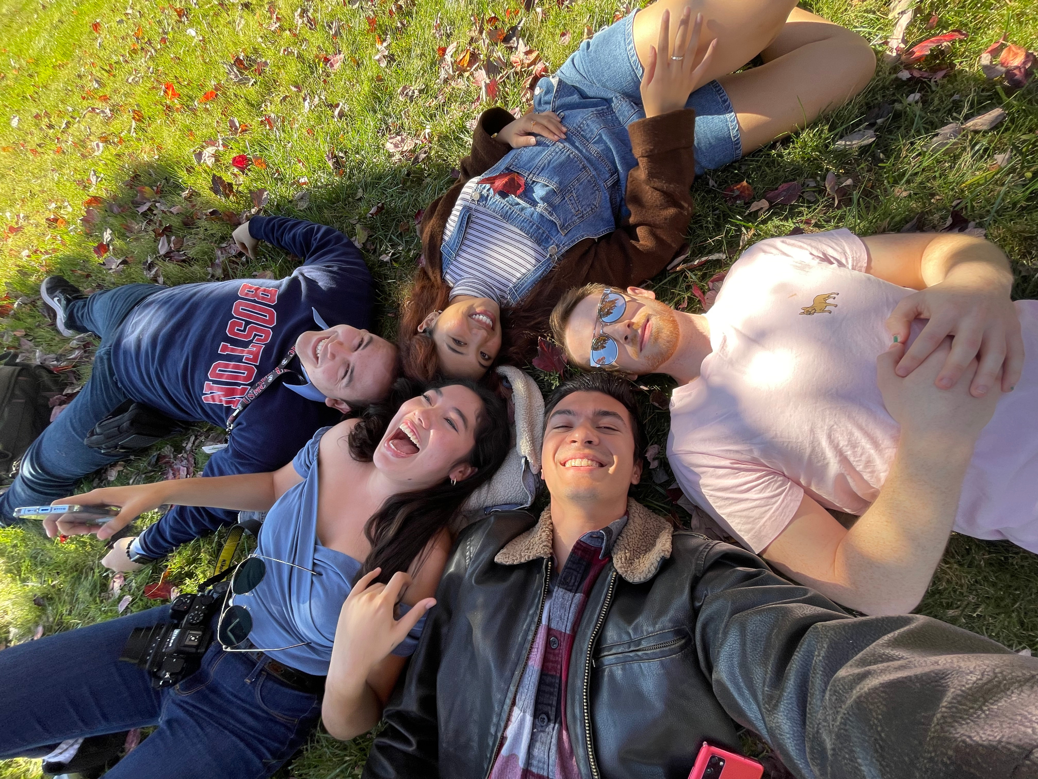 Andrew Neciuk lying down in the center, surrounded by a group of peers in Washington D.C.